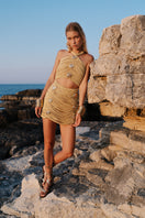 Gigii's Lumina mini dress featuring a stylish, fitted design with vibrant fabric and elegant details perfect for trendy occasions.
