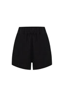 Labeca Luna black linen shorts displayed on a model, showcasing lightweight, breathable fabric and casual style.
