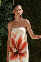 Nana Gotti Lunara maxi dress featuring a flowing silhouette and floral print, perfect for elegant summer wear.