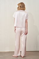 Pink silk short-sleeve pajama set for women by MANITO, featuring a comfortable, smooth fabric and relaxed fit.