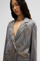Maccapani TATS blazer in sand sky color, tailored fit blazer with classic lapel and sleek design, displayed on a hanger.