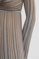 Maccapani Terry Dress in Sand Sky, a flowy maxi dress with soft fabric and relaxed fit, displayed on a mannequin.