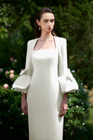 Elegant I.H.F column gown featuring a trapeze neckline and rose draped three-quarter sleeves, displayed on a mannequin.