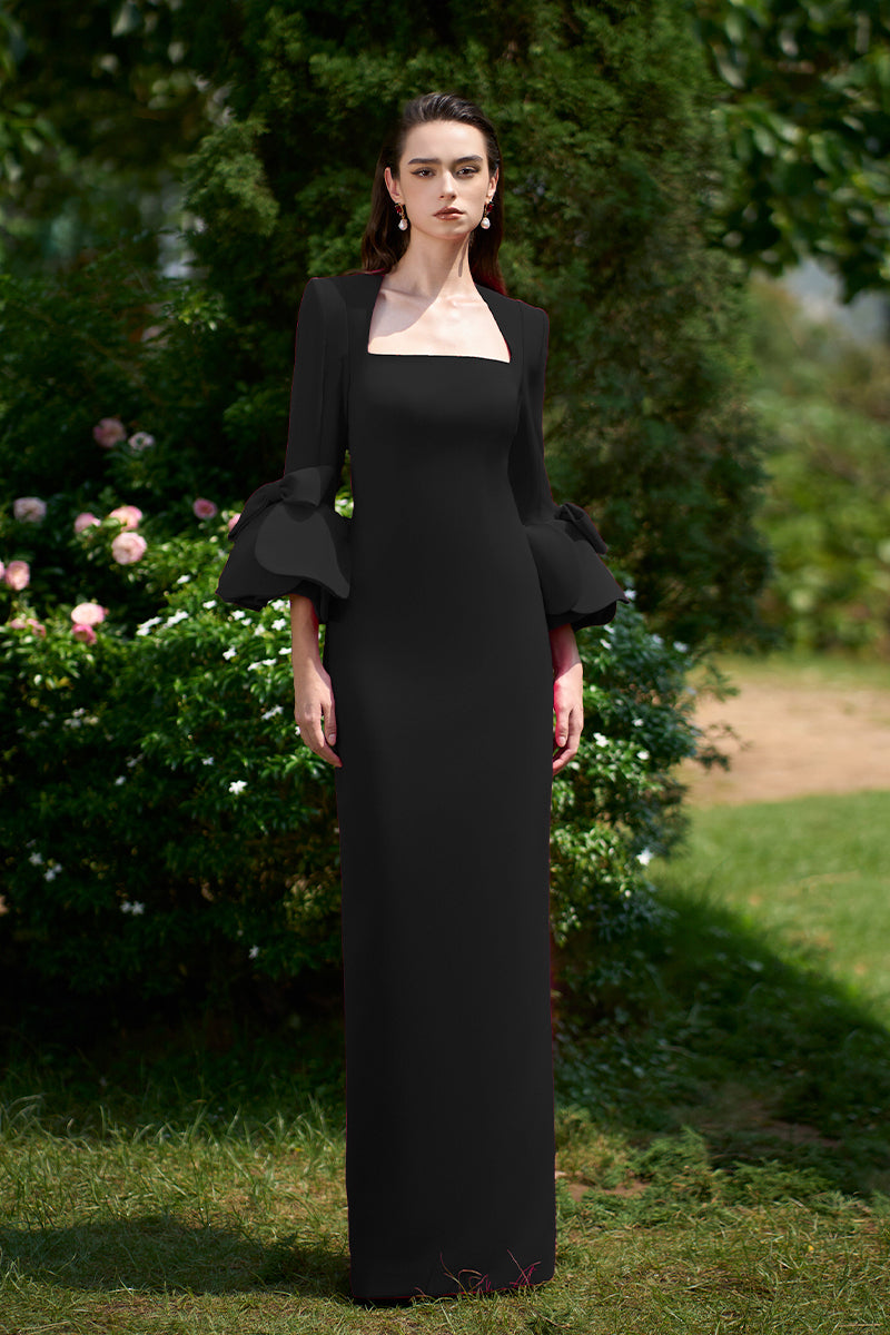 BLACK COLUMN GOWN WITH TRAPEZE NECKLINE AND ROSE DRAPED THREE-QUARTER SLEEVES | CULT MIA | I.H.F BLACK COLUMN GOWN WITH TRAPEZE NECKLINE AND ROSE DRAPED THREE-QUARTER SLEEVES | CULT MIA | I.H.F