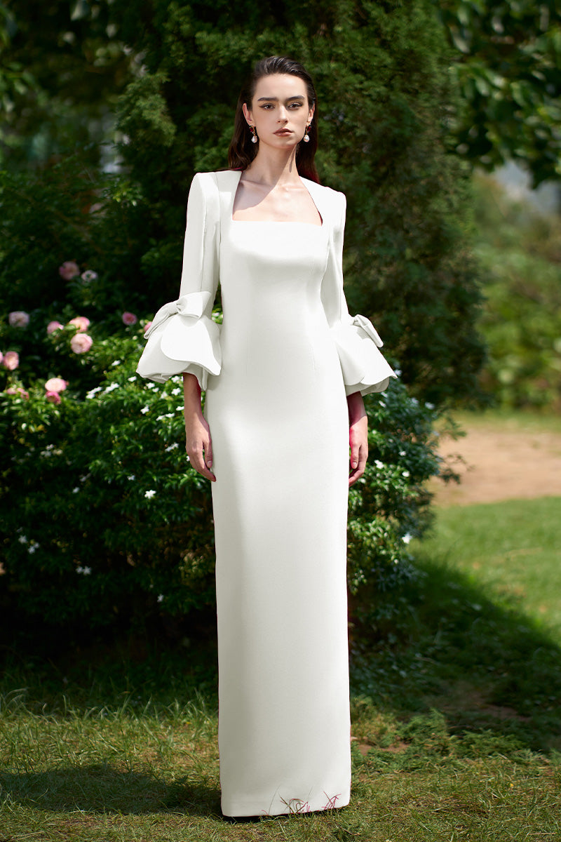 I.H.F column gown with trapeze neckline and rose draped three-quarter sleeves, elegant evening dress with flowing silhouette.
