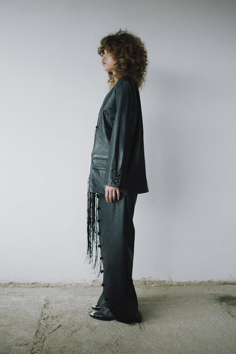 Black leather macramé blazer by MAZ Manuela Álvarez featuring intricate woven details and tailored fit.
