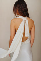 White Maja maxi dress by Sisters, flowing fabric and elegant design shown on a model in this stylish maxi dress image.