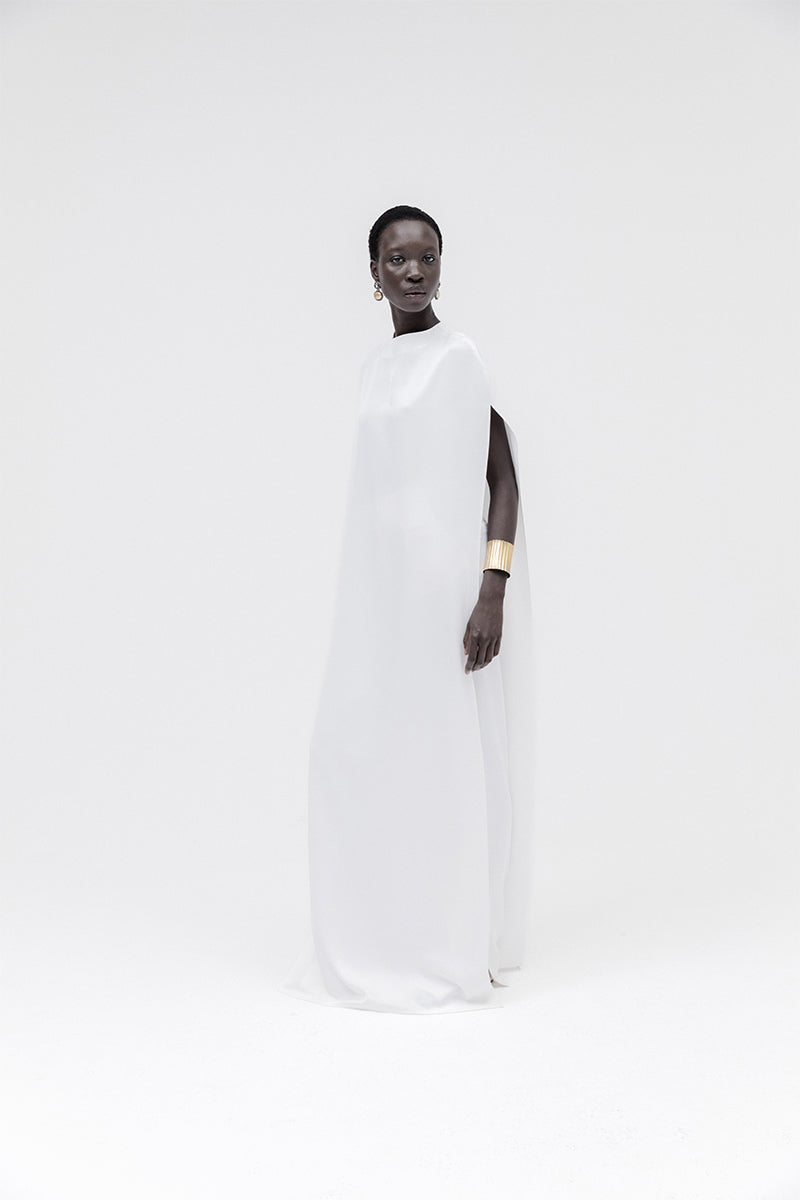 Studio NK ivory marble cape top, featuring a stylish and elegant design, showcased on a model.