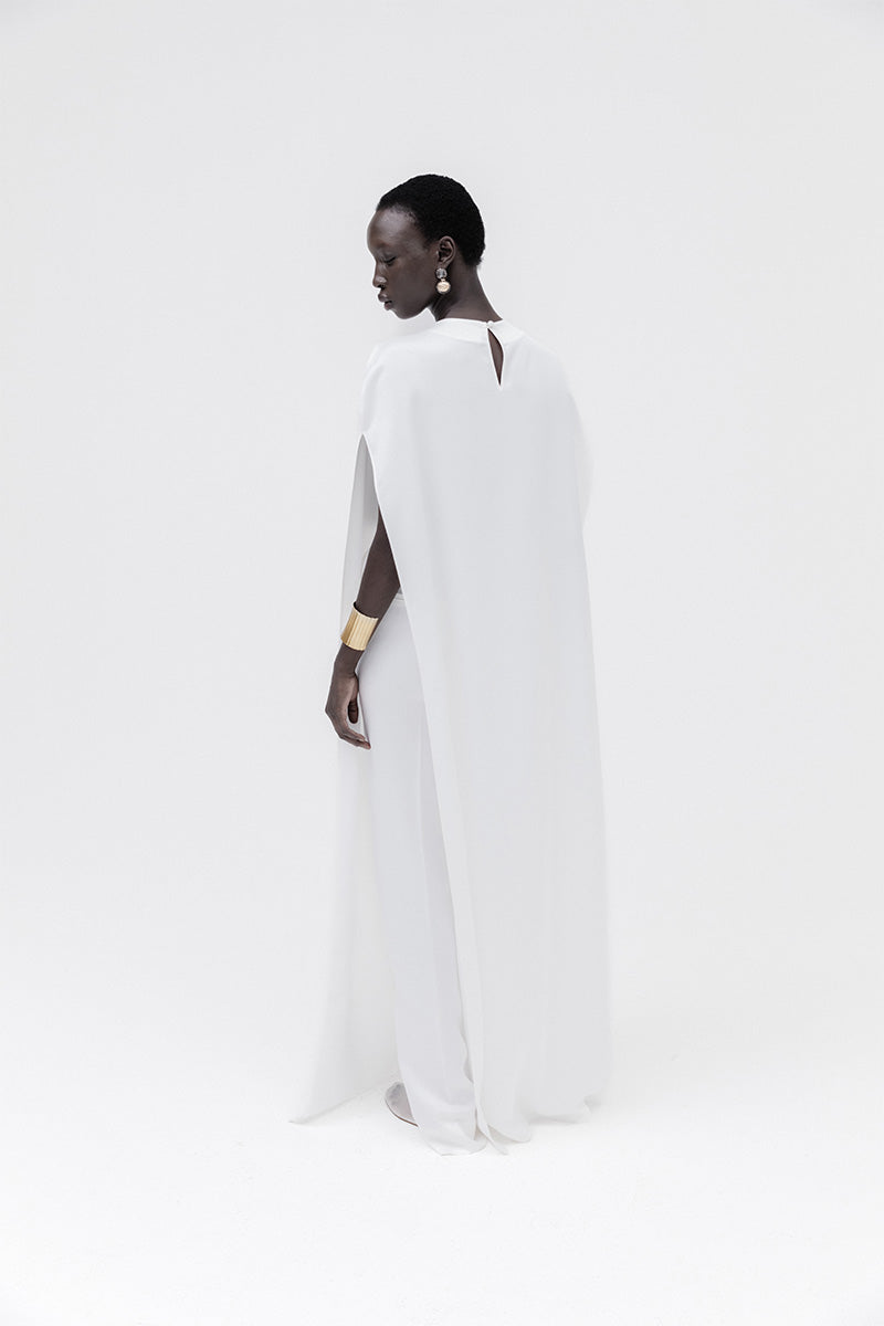 Ivory marble cape top by Studio NK featuring a flowing, elegant design with marble-inspired pattern and soft fabric.