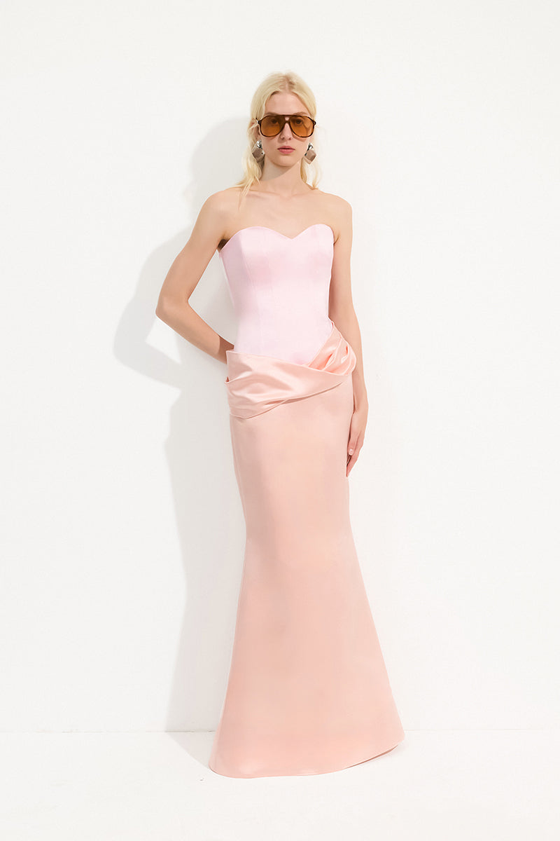 Blush pink MARIVEN maxi dress by URBAN MUSE, flowing fabric and elegant design, shown on a model.
