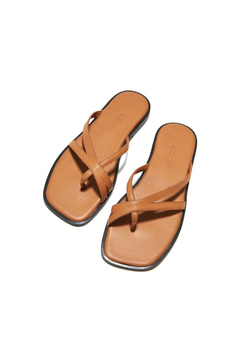 Tan MARK sandals by KIÓHNE featuring comfortable straps and casual style, perfect for everyday wear.