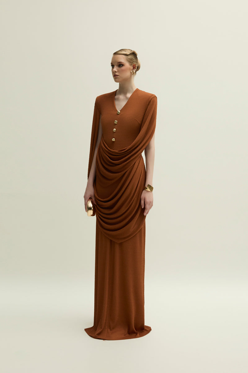 Jenny K Tran Marly gown in burnt orange, elegant evening dress with flowing fabric and modern design, front view.