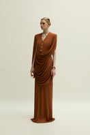 Jenny K Tran Marly gown in burnt orange, elegant evening dress with flowing fabric and modern design, front view.