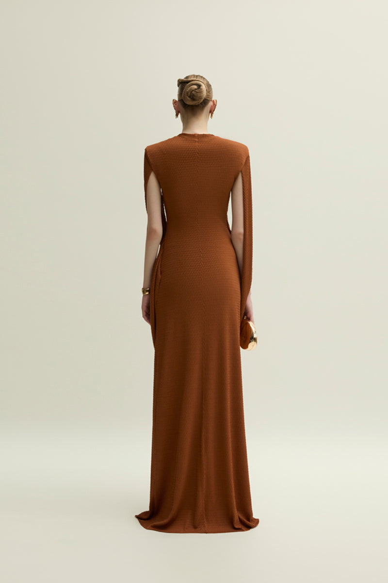 Jenny K Tran Burnt Orange Marley gown featuring flowing fabric and elegant design, perfect for formal occasions.