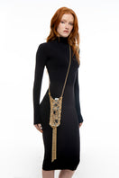Gold shoulder bag by Silvia Gnecchi, The Bottle Case in sleek design with a structured shape and stylish gold finish.
