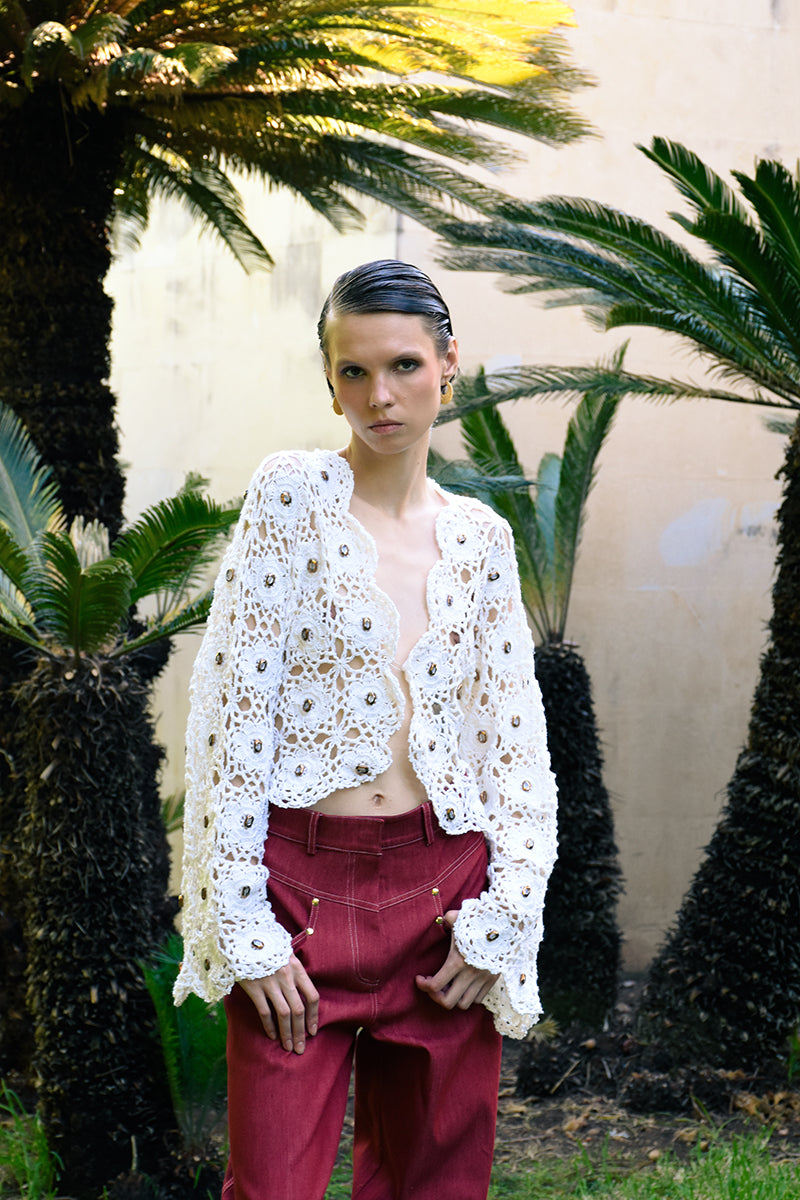 White Jessica K Mayra cardigan with crystal embellishments, featuring a cozy knit design and elegant detailing.