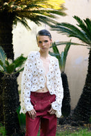Jessica K Mayra white cardigan with crystal embellishments, featuring a soft knit fabric and elegant design.