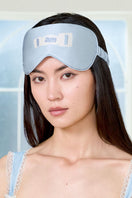 Blue MBTI silk eye mask by MANITO, soft and comfortable sleep mask with MBTI logo for relaxed rest and style.