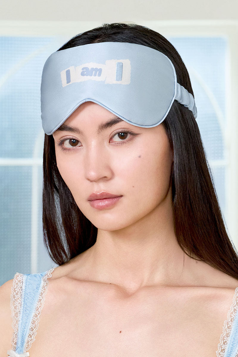 Blue MBTI silk eye mask by MANITO, soft and comfortable sleep mask with MBTI logo for relaxed rest and style.