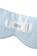 Blue silk eye mask from MANITO featuring MBTI design, soft and comfortable for restful sleep or relaxation.