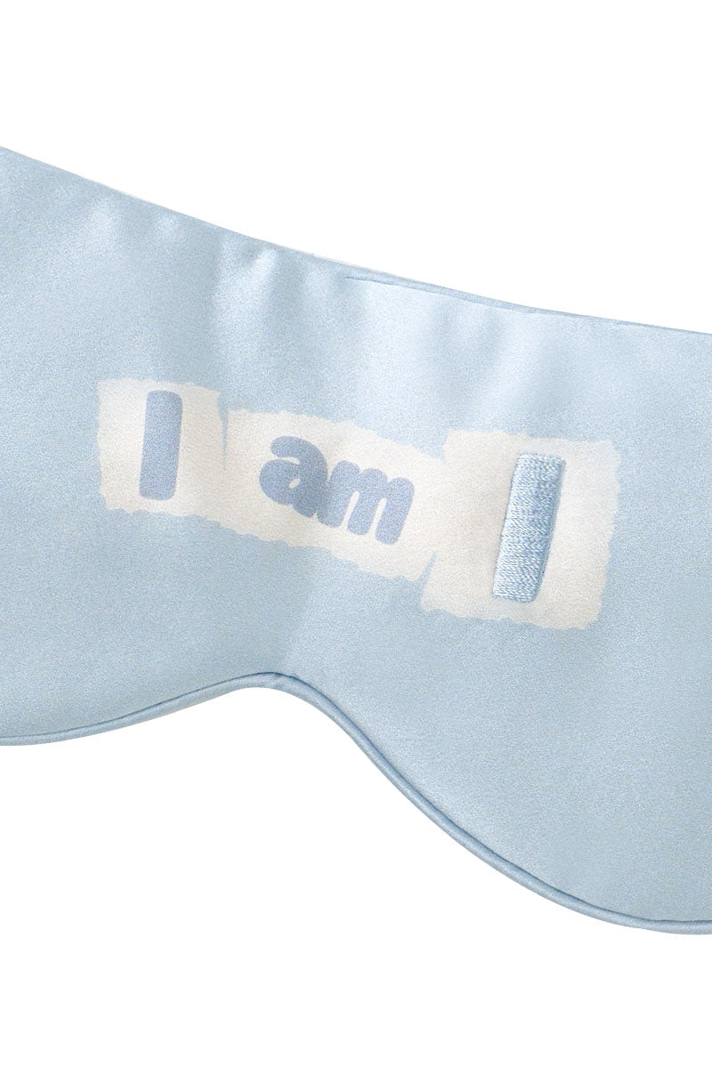 Blue silk eye mask from MANITO featuring MBTI design, soft and comfortable for restful sleep or relaxation.