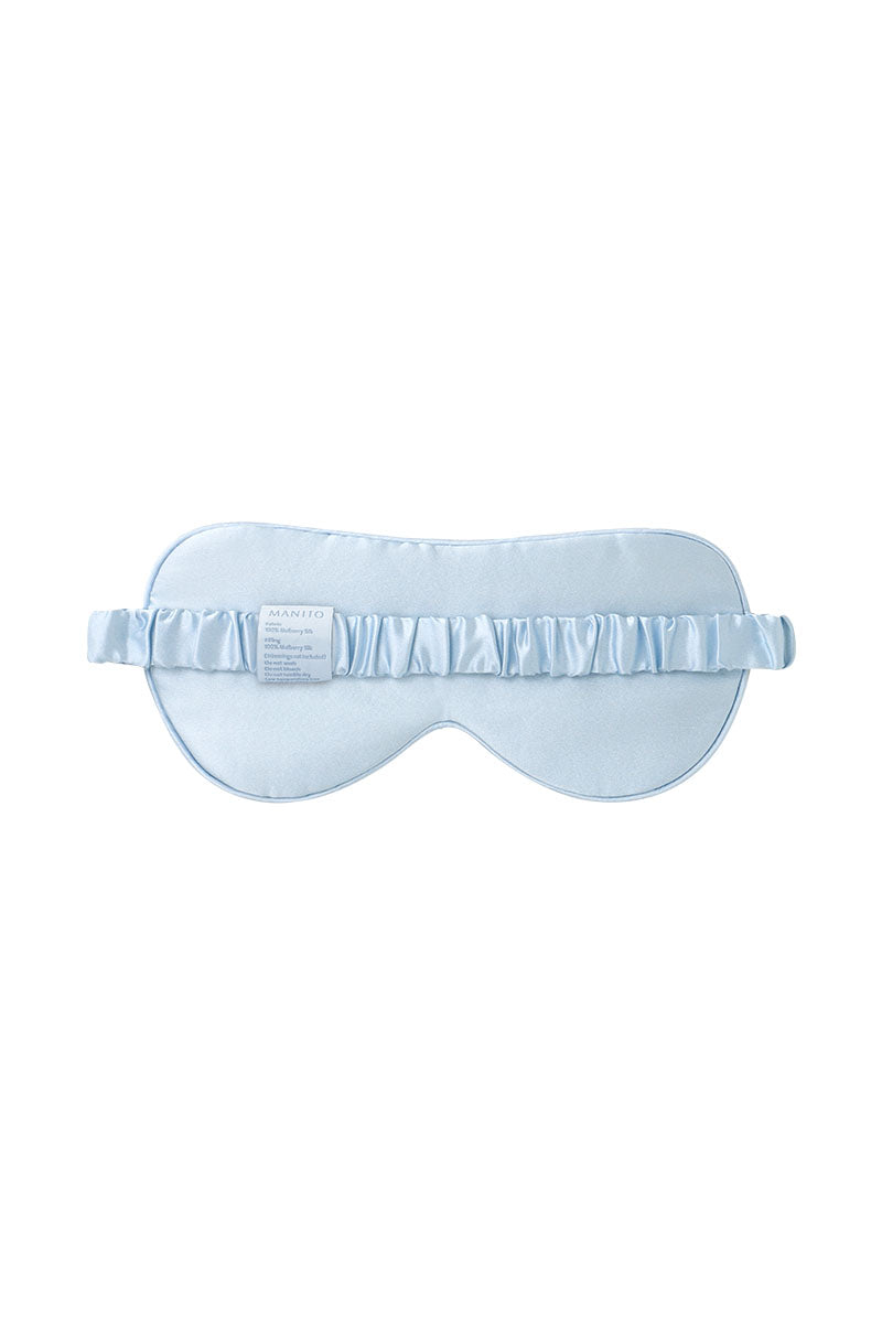 Blue silk eye mask by MANITO featuring a smooth, luxurious fabric designed for comfortable sleep and relaxation.