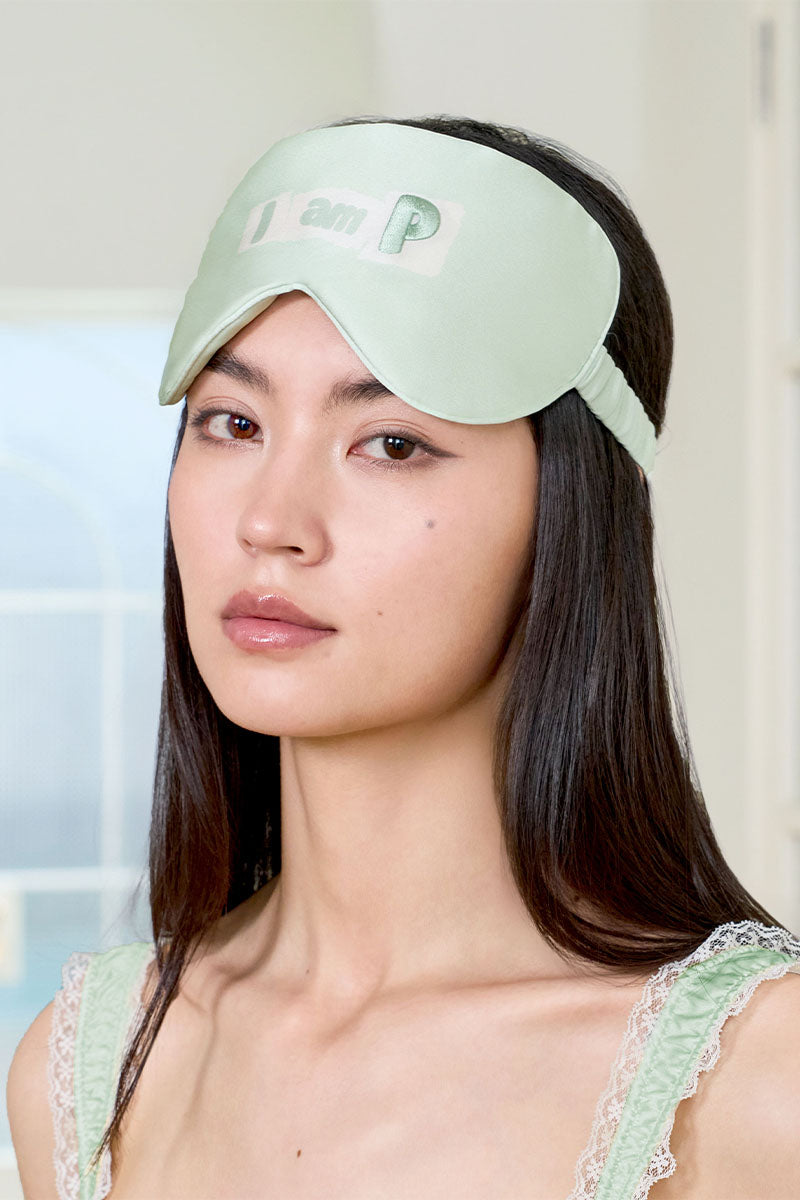 Green silk eye mask from MANITO's MBTI series, soft and comfortable for sleep and relaxation.