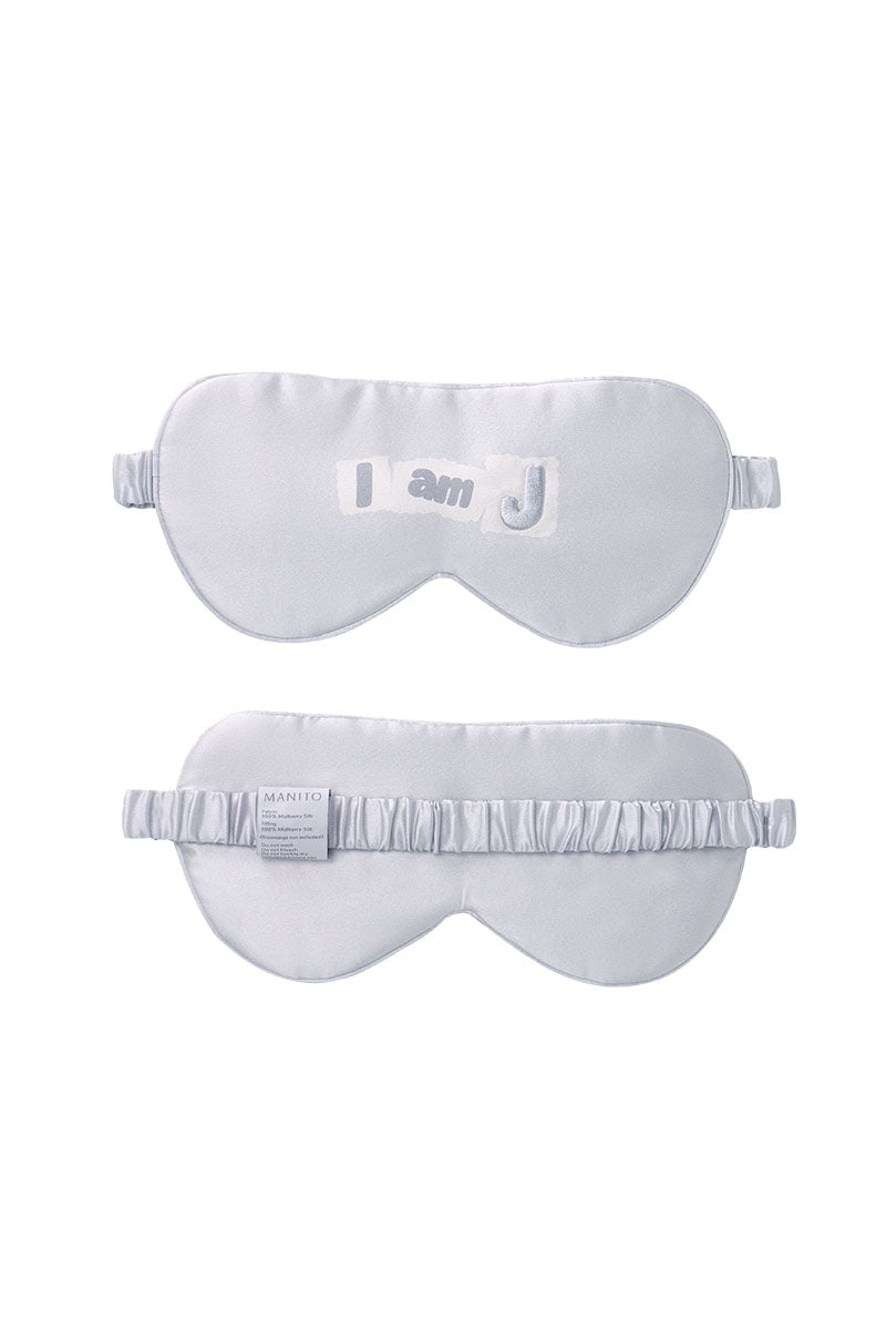 Gray silk eye mask from MANITO's MBTI SILK collection, designed for comfortable sleep and relaxation.