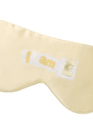 Yellow silk eye mask by MANITO with MBTI-themed design, soft and comfortable for restful sleep.