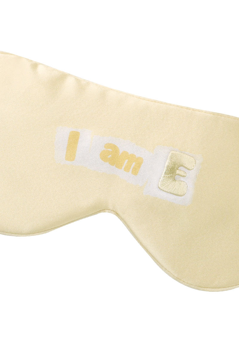 Yellow silk eye mask by MANITO with MBTI-themed design, soft and comfortable for restful sleep.
