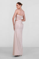 Elegant champagne draped corset gown by Monika Dimova featuring luxurious fabric and intricate design details.