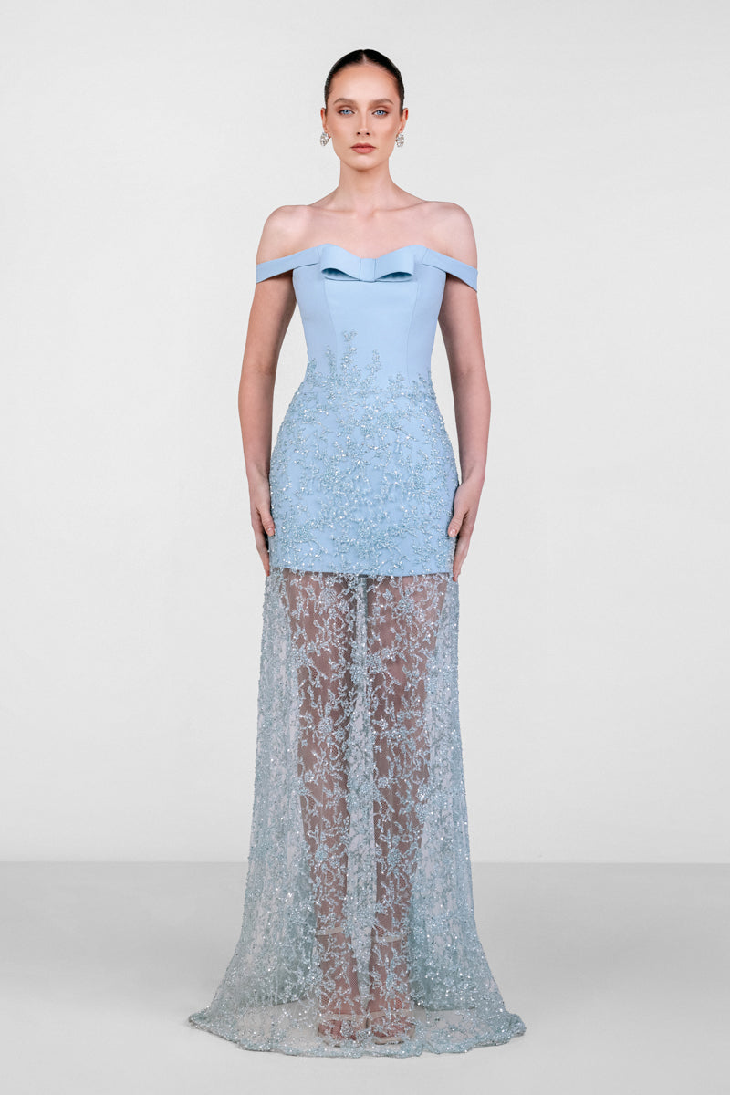 Blue embroidered lace gown by Monika Dimova, featuring intricate lace details and elegant flowing fabric.