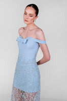 Blue embroidered lace gown by Monika Dimova, featuring intricate lace details and elegant flowing fabric.