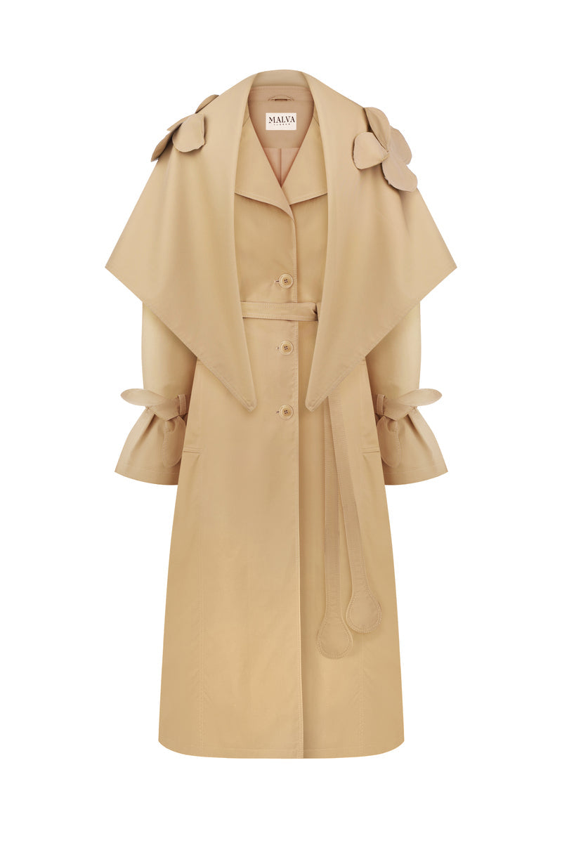 Beige relaxed trench coat by Malva Florea with a detachable scarf, stylish and lightweight outerwear for cooler weather.