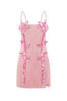 Peony pink mini dress by Malva Florea featuring floral sequin appliqués, with a fitted silhouette and elegant design.