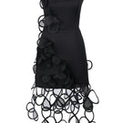 Black sheer mini dress with floral appliqués by MALVA FLOREA, featuring delicate floral details on a fitted silhouette.