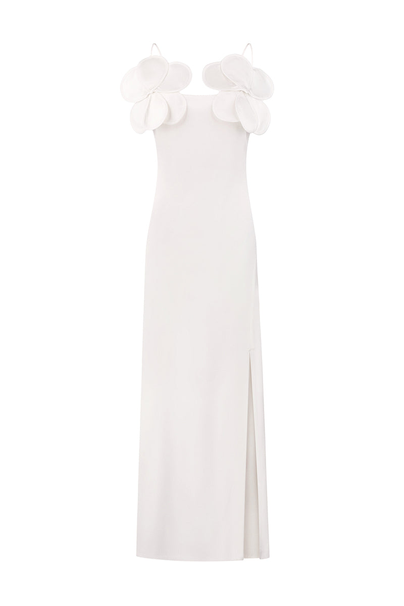 Ivory maxi dress by Malva Florea featuring long silhouette and floral appliqués, elegant sheath style with intricate detailing.