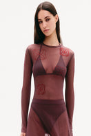 Dark purple flowy mesh maxi skirt by Malva Florea, featuring a lightweight, flowing design perfect for elegant styles.