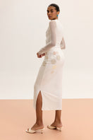 Long-sleeved sheer bodysuit from Malva Florea, lightweight and fitted, shown in white with delicate fabric details.