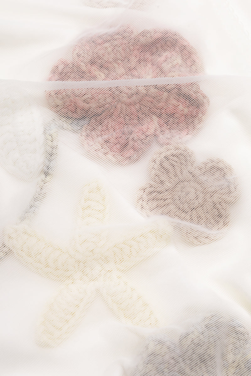 Long-sleeved sheer bodysuit with floral appliques by Malva Florea, showing delicate lace and elegant design details.
