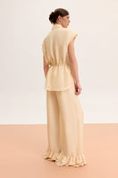 Light blue sleeveless button-up blouse from Malva Florea, stylish shirt with a collar and front buttons.