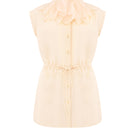 Light blue sleeveless button-up blouse by Malva Florea, front view showing collar and button details.