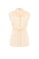 Light blue sleeveless button-up blouse by Malva Florea, front view showing collar and button details.