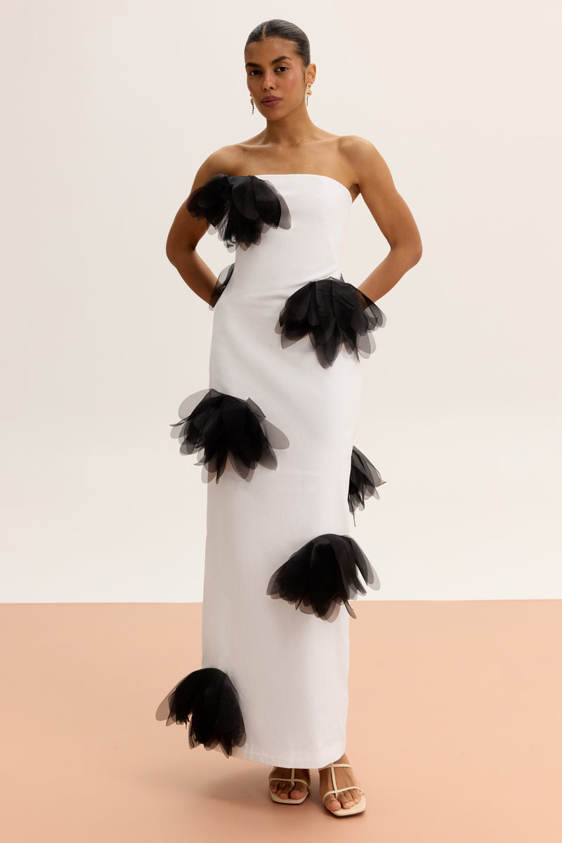 White strapless column maxi dress by Malva Florea, featuring a sleek, elegant silhouette perfect for formal occasions.