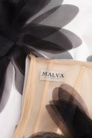 White strapless column maxi dress by Malva Florea with floral appliqué details, elegant and floor-length for formal occasions.