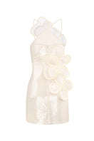 Back view of MALVA FLOREA sequin mini dress with long sleeves and vibrant yellow color, showcasing its stylish design.