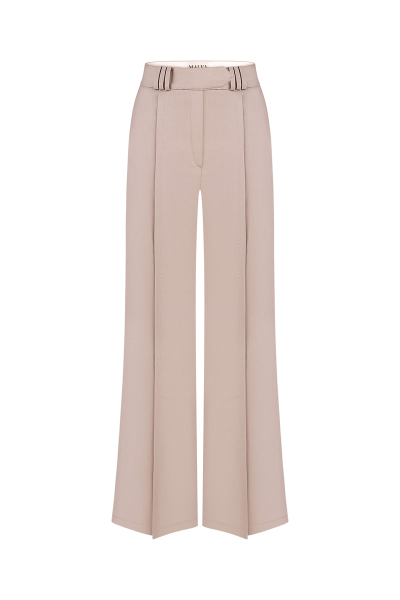 Front view of MALVA FLOREA bias-cut pants with a high waist and flowing fabric in a neutral color.