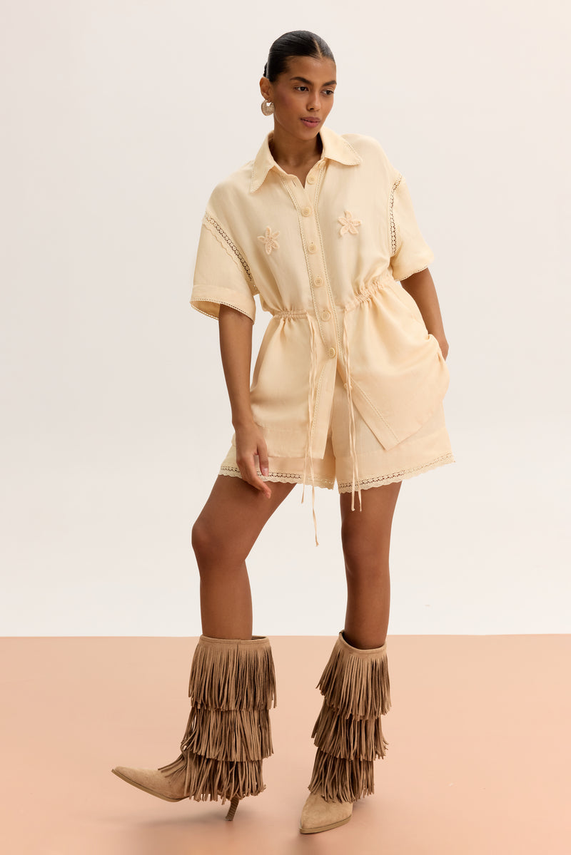 Pair of matching high-waisted shorts from MALVA FLOREA, showcasing lightweight fabric and stylish fit in a natural pose.