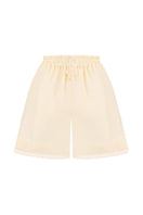 Back view of MALVA FLOREA matching high-waisted shorts, stylish pants with a fitted waistband and tailored fit.