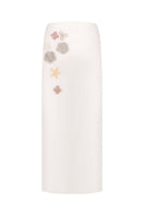 Back view of white high-waisted embellished pencil midi skirt by MALVA FLOREA, showcasing detailed decorative accents and tailored fit.